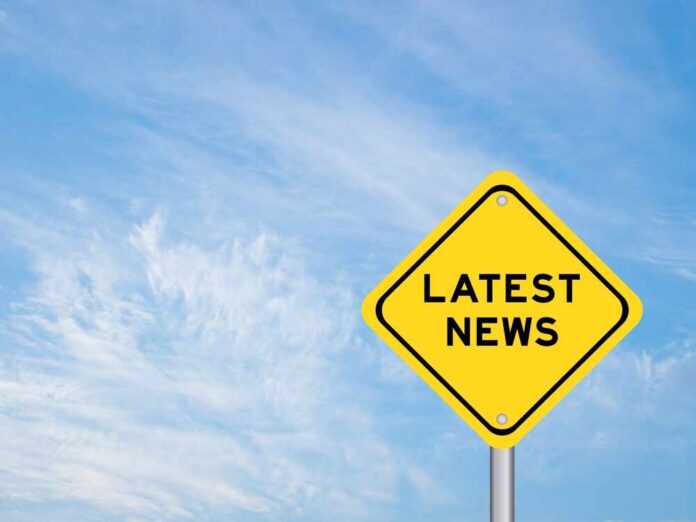 shutterstock_2530090361.jpg featured image Yellow sign with text Latest News on sky background