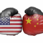 American and Chinese flag boxing gloves facing off