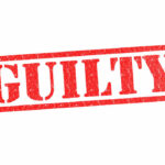 Red stamp with the word guilty inside