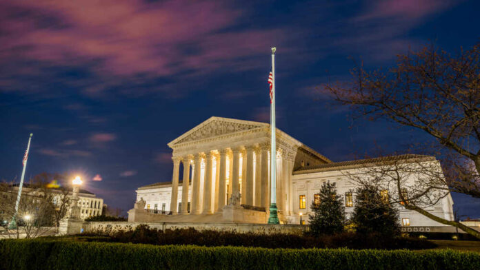 shutterstock_1355731721.jpg featured image The United States Supreme Court building at dusk.