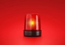 Red emergency light on red background