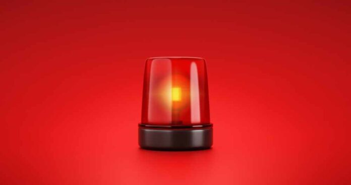 shutterstock_2053758056.jpg featured image Red emergency light on red background