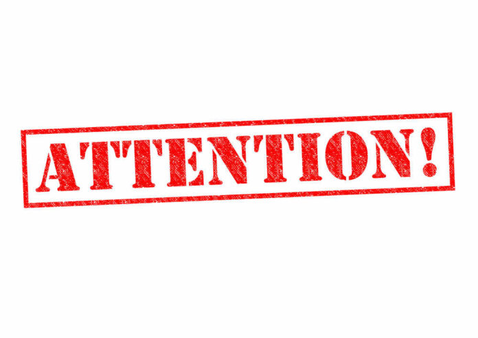 shutterstock_214851508.jpg featured image Red attention stamp on white background