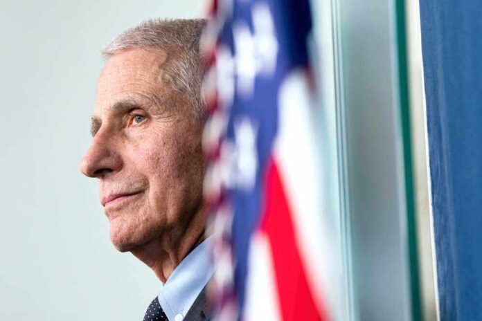 shutterstock_2465460457.jpg featured image Anthony Fauci close-up with flag.