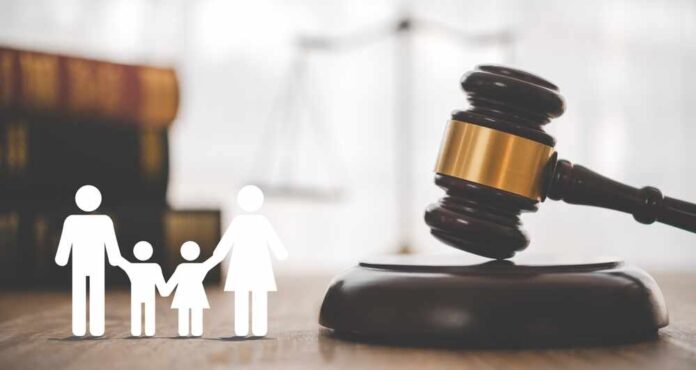 shutterstock_2509112733.jpg featured image Gavel with family symbols and legal book background.