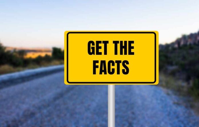 shutterstock_2512615135.jpg featured image Yellow sign reads Get the Facts on road.