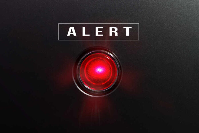 shutterstock_582441490.jpg featured image Red alert light on black background