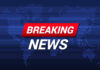 Breaking News text on world map background.
