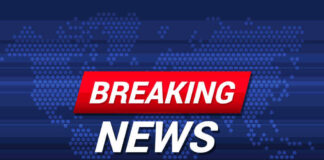 Breaking News text on world map background.