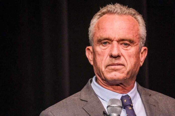 Robert F. Kennedy JR holding microphone.