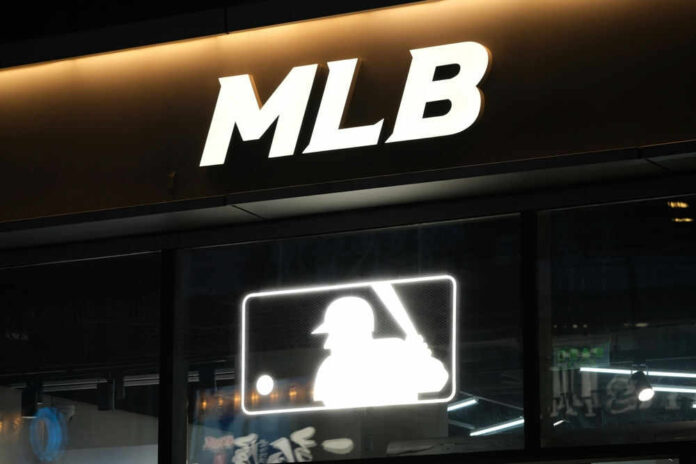 shutterstock_2158703275.jpg Illuminated MLB sign above storefront window