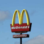 McDonald’s Announces New Specialty Drinks McDonald’s drive-thru sign against a blue sky