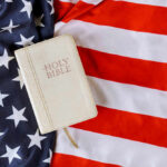 Bible on an American flag background