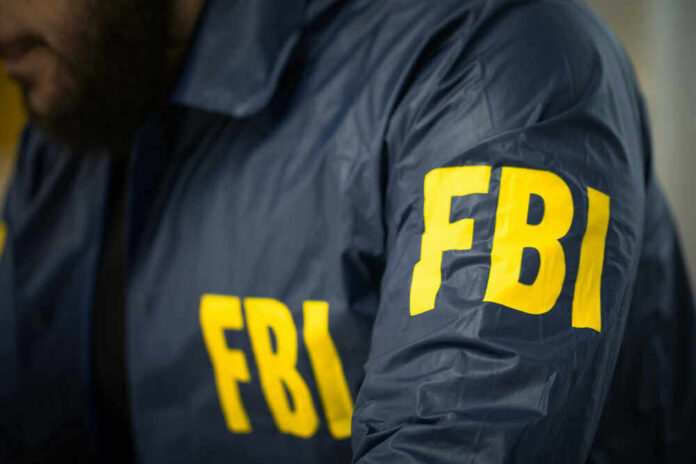 FBI agent in navy blue jacket