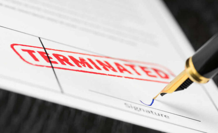 Termination document being signed with fountain pen