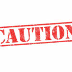 Red caution sign with grunge texture diagonal