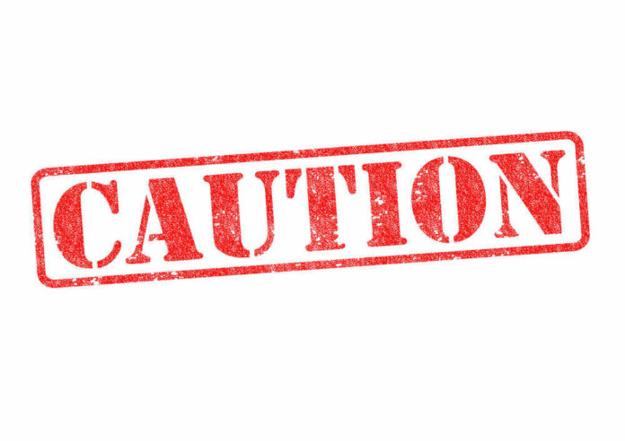 Red caution sign with grunge texture diagonal