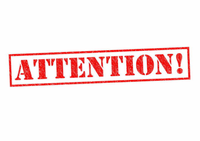 shutterstock_214851508.jpg Red attention stamp on white background