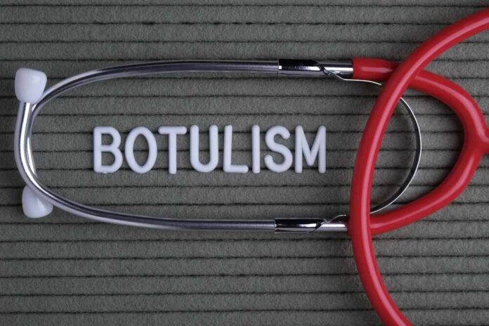 Stethoscope and the word 'BOTULISM' on a textured background