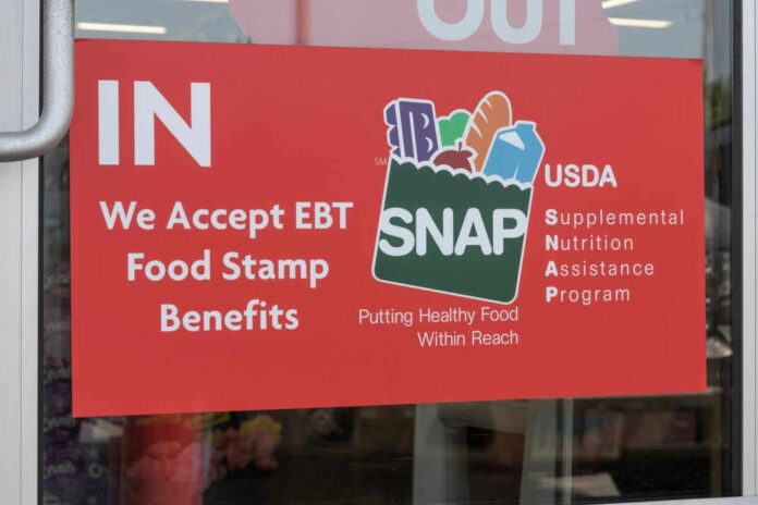 Red sign accepting EBT food stamp benefits SNAP
