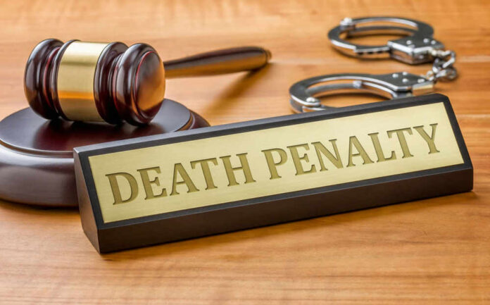 Gavel handcuffs and death penalty sign on table