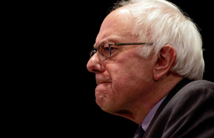 Bernie Sanders in glasses.
