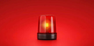 Red emergency light on red background