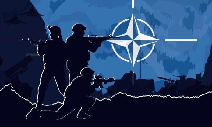 Silhouettes of soldiers with weapons against a blue background featuring the NATO emblem
