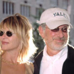 Spielberg Moves — Another California Escapee Two individuals at a public event, one wearing sunglasses and a Yale cap