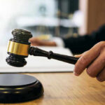 LANDMARK Verdict Shakes Meta, YouTube Gavel in judges hand about to strike.