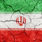 Cracked texture of the Iranian flag with green, white, and red colors