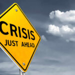 War-Driven Oil Shock Threatens U.S. Prices A yellow warning sign indicating a crisis ahead