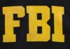FBI logo displayed in large yellow letters on a black background