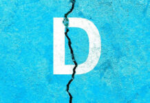 White letter D on cracked blue surface.
