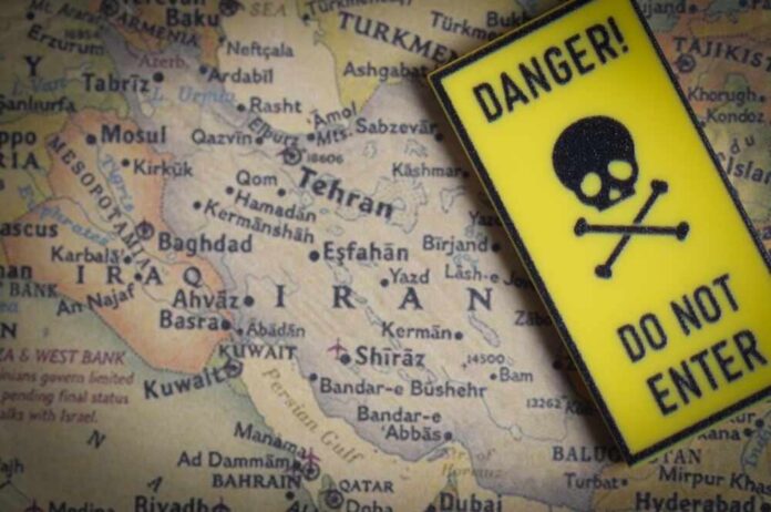 A danger sign placed over a map of the Middle East