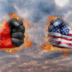 German Leader SLAMS Trump Iran Plan Two fists, one painted with the German flag and the other with the American flag, clashing against a fiery background