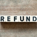 $166 Billion Refund Avalanche Starting Wooden blocks spelling the word 'REFUND' on a wooden surface