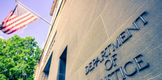 Department of Justice building with American flag.