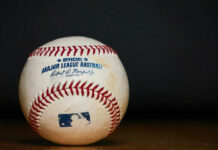 VIDEO: Pitcher PUNCHES With Baseball — Unbelievable Brawl Major League Baseball ball with commissioner signature and logo.