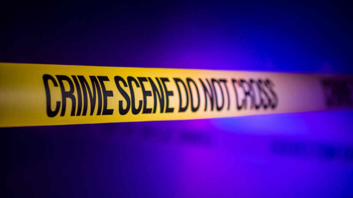 Yellow crime scene tape with the words 'CRIME SCENE DO NOT CROSS'