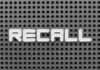 The word 'RECALL' displayed on a perforated surface
