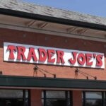 Exterior view of a Trader Joe's grocery store with a prominent sign