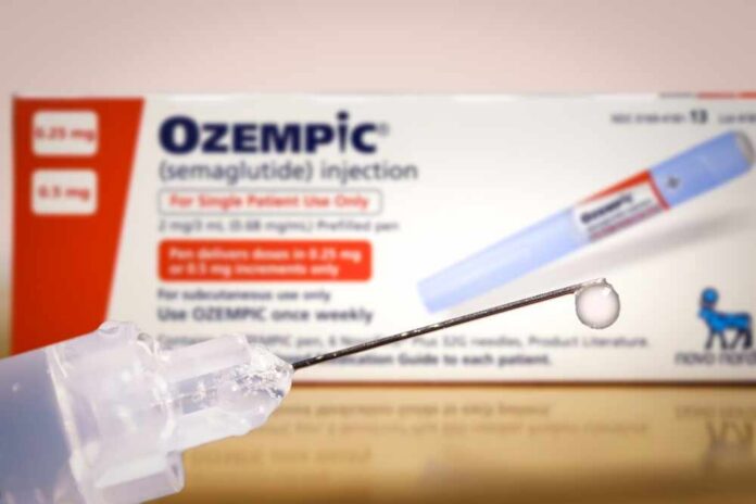 Ozempic injection pen with a droplet at the needle tip
