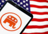 Smartphone with Republican Party logo, American flag background.