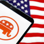Smartphone with Republican Party logo, American flag background.