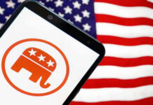 Smartphone with Republican Party logo, American flag background.
