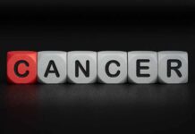 Blocks spelling the word 'CANCER' with one block in red