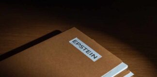 Stack of brown file folders with a label reading 'EPSTEIN'