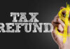 Hand writing 'TAX REFUND' with a dollar sign