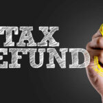 Tax Refunds JUMP — One Bill Changed Everything Hand writing 'TAX REFUND' with a dollar sign